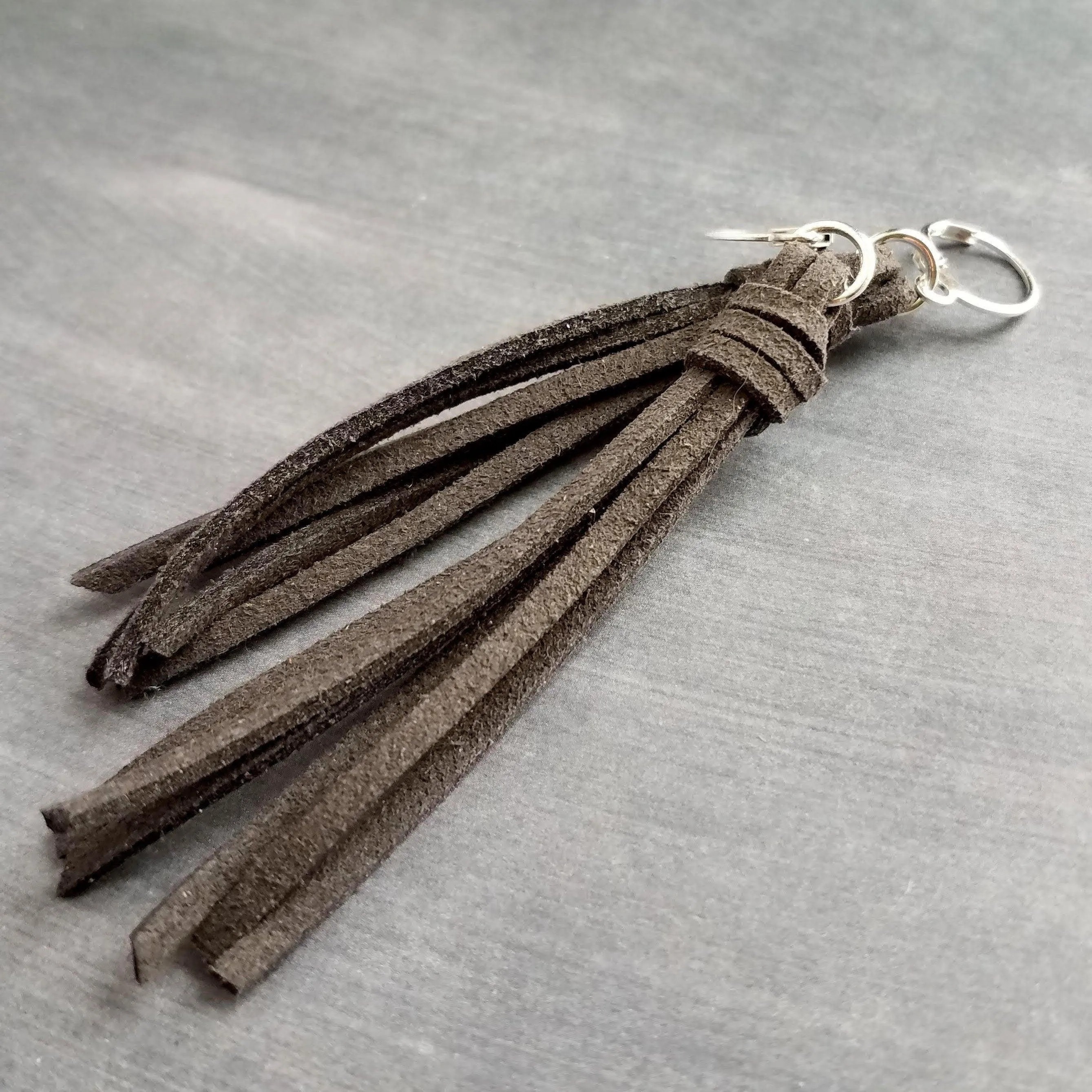 Dark Grey Long Tassel Earrings, faux suede tassel, vegan leather tassel, long gray tassel, silver huggie hoop, round lever back boho earring