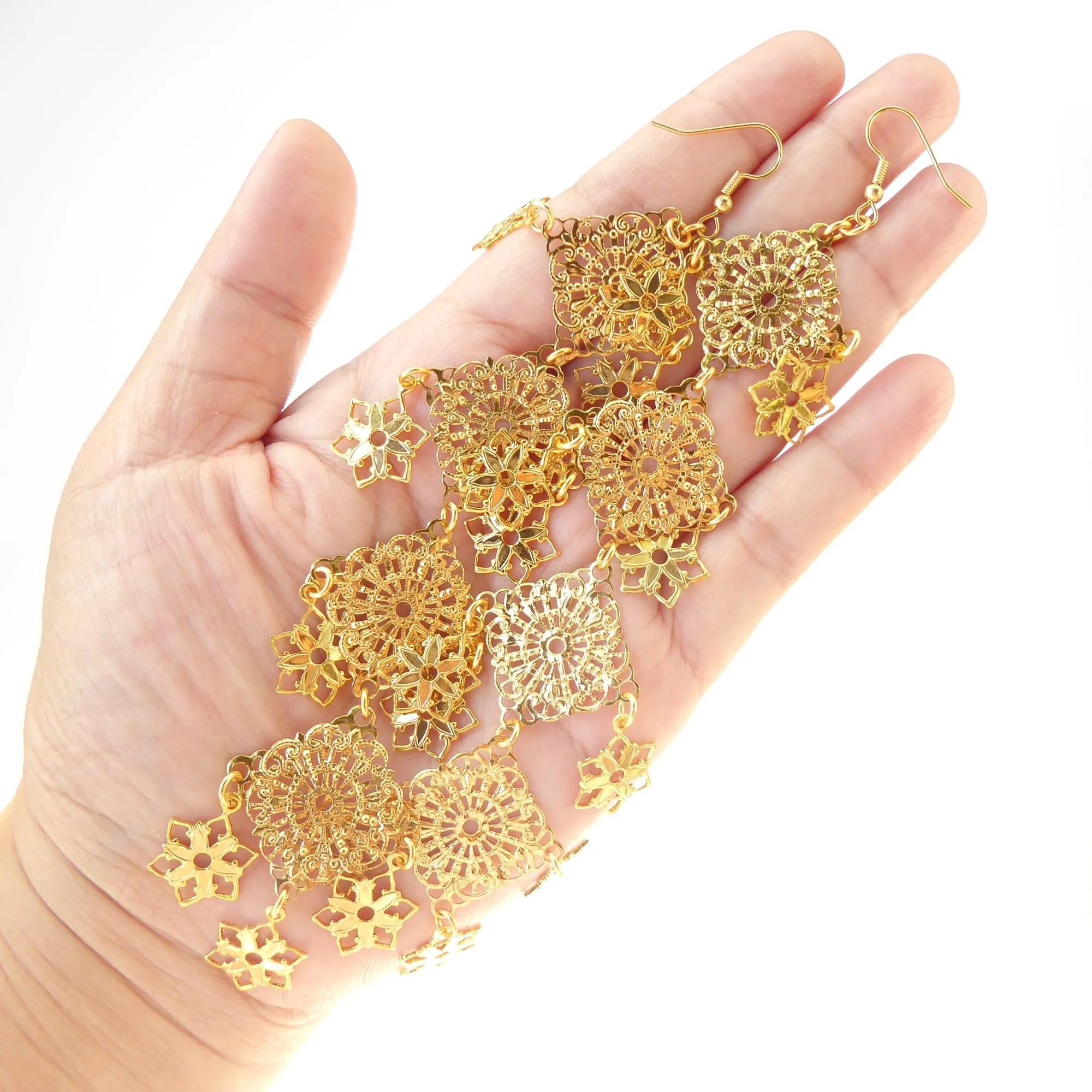 Gold long estrella earrings